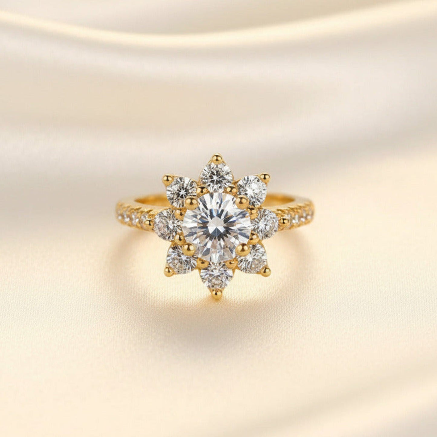 Gold ring with a gemstones in a flower pattern on a soft beige background