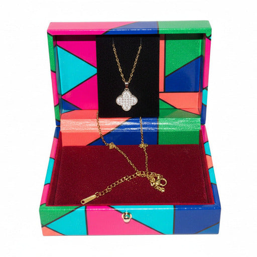 This gold version radiates warmth and classic elegance, highlighting the iconic four-leaf clover motif and its association with luck and fortune.