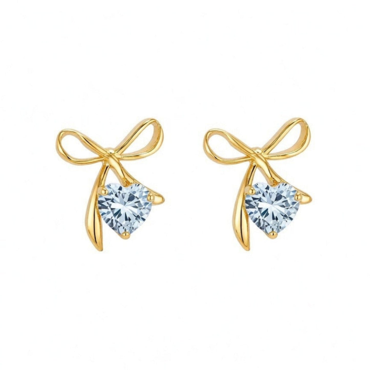 Gold bow-shaped earrings with heart-shaped gemstones on a white background