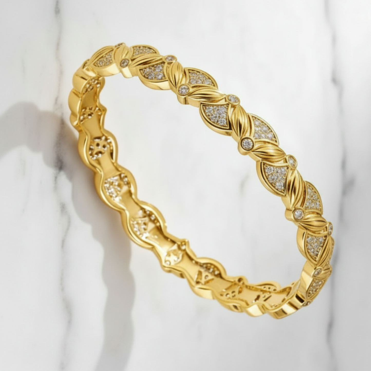 Gold bracelet with diamond accents on a light background