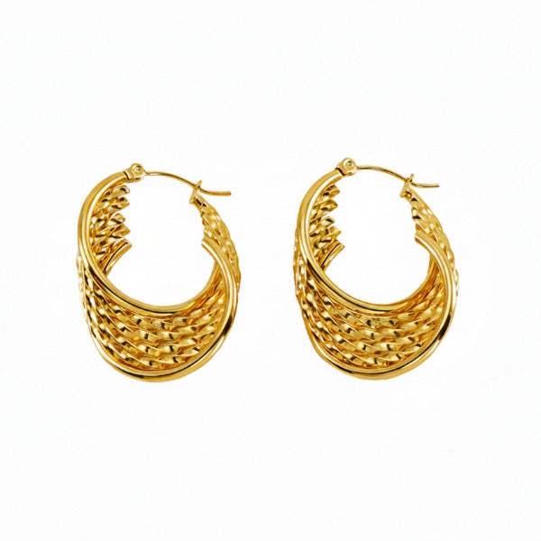 The weave design creates a captivating texture that allows light to reflect uniquely off its varied surfaces, giving the earrings a dynamic shimmer and enhancing their perceived value and craftsmanship in different lighting conditions.