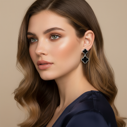 Woman wearing black dangle double clover-shaped earrings on a silver tone metal.