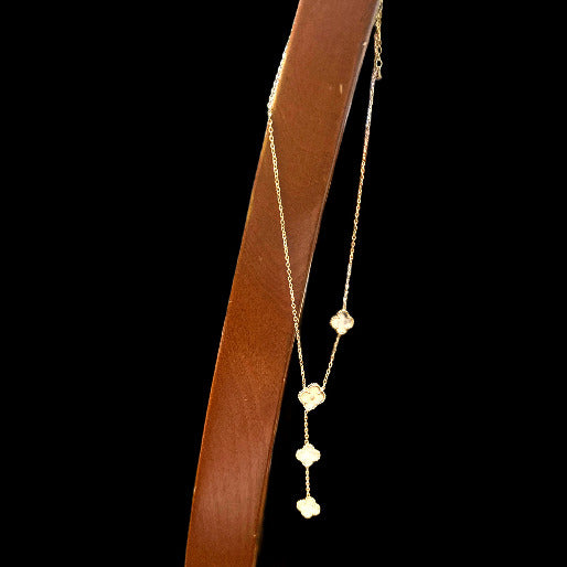 The necklace Y-drop configuration enhances the neckline, and emphasizes the vertical line.