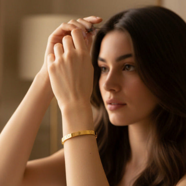 Young woman showing Gold Eternity Bracelet