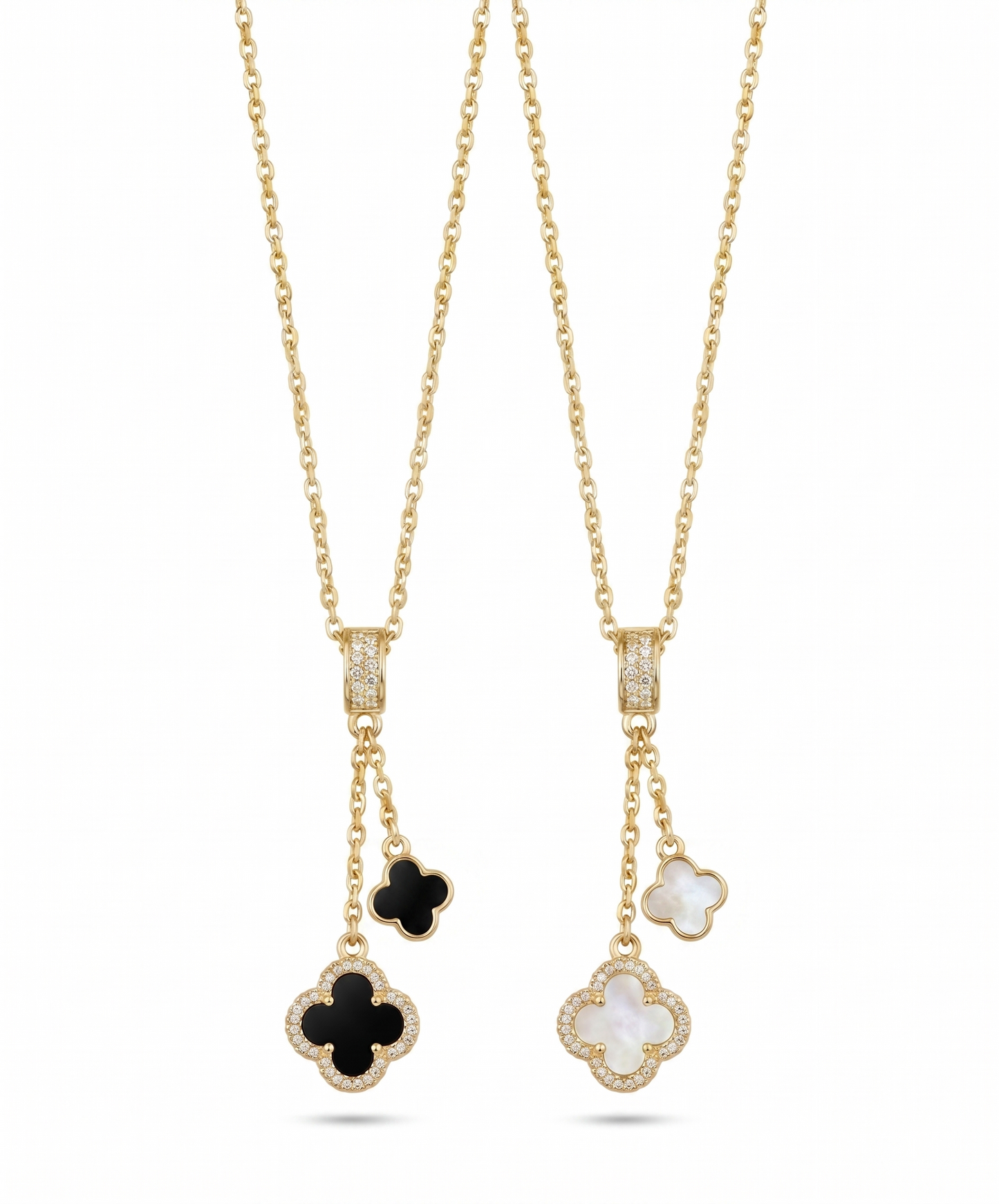 Two gold necklaces with clover-shaped pendants on a white background