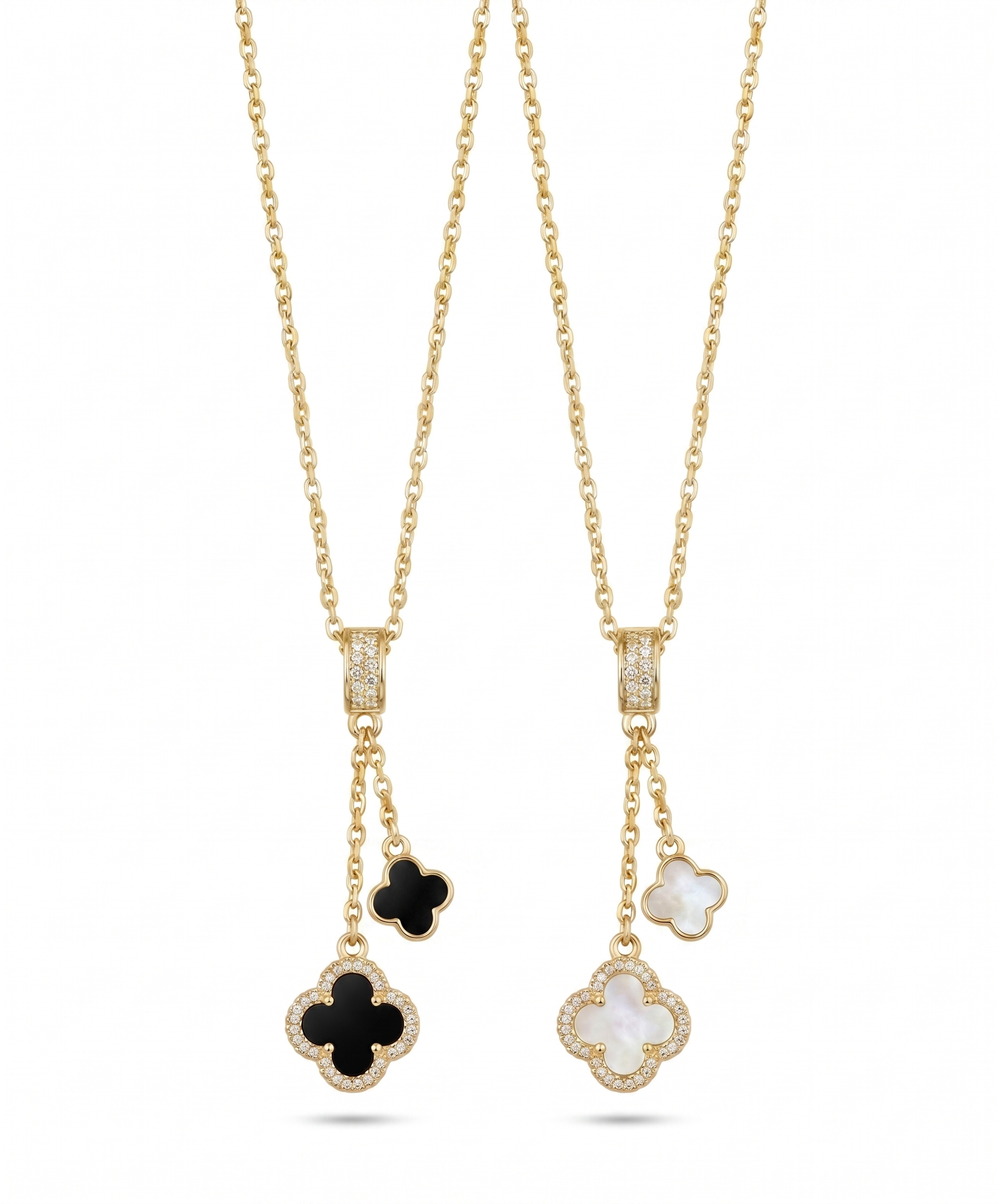 Two gold necklaces with clover-shaped pendants on a white background