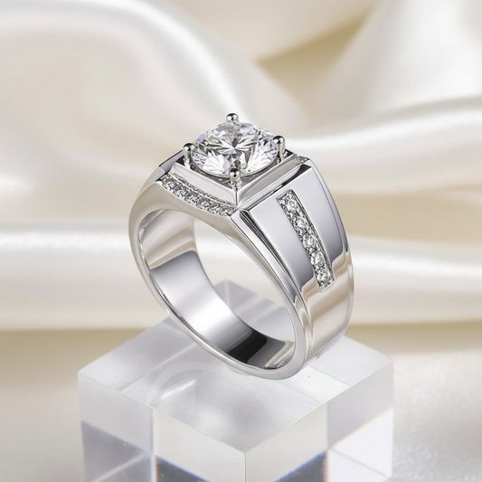 Silver ring with a large gemstone and smaller diamonds on a light gray background