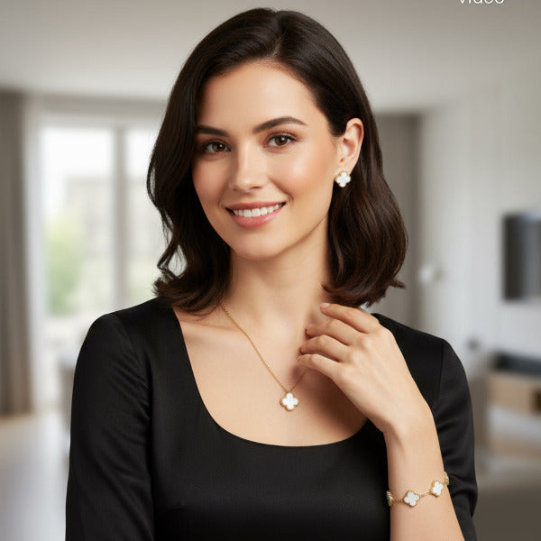 This is a matching three piece jewelry set, featuring. a distinctive four leaf. clover motif. All pieces are. crafted in stainless steel covered in.18K gold, and a smooth white.  mother of pearl like inlay within each clover, offering a cohesive. and sophisticated look.