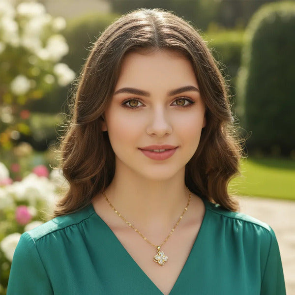 This elegant necklace features a delicate gold plated chain and a captivating flower shaped pendant. The design has a rotating mechanism, making it a fidget accessory.  It is a perfect conversation starter and a stylish blend of aesthetic and functionality.