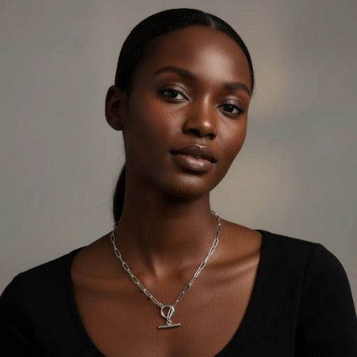 The necklace is secure with a distinctive toggle clasp, consisting of a circular ring and a T-bar that passes through it, adding a stylish detail to the piece.