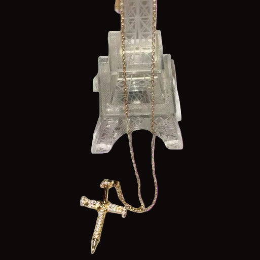 The pendant is connected to a delicate,  matching gold chain, making it suitable for daily wear or as a meaningful gift.