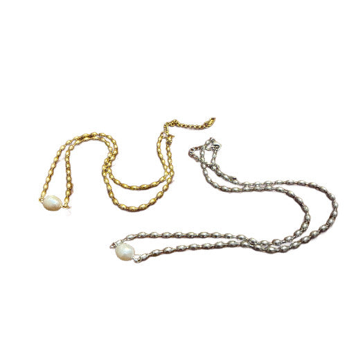 Two pearl necklaces with a pearl pendant on a white background