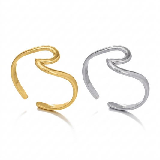 Gold and silver open wave rings on a white background. This image perfectly captures the artistic simplicity of the wave motif. without any additional embellishment, the beauty lies in the graceful lines and the natural luster of the gold plating.