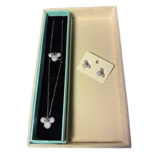 Silver Minnie Jewelry set showing the necklace, the earrings and the ring.