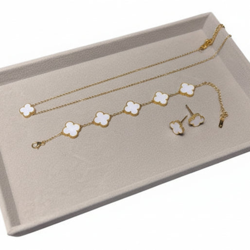 One necklace, one bracelet and one pair of earrings, with a four leaf clover white inlay motif and 18k gold-plated finish.