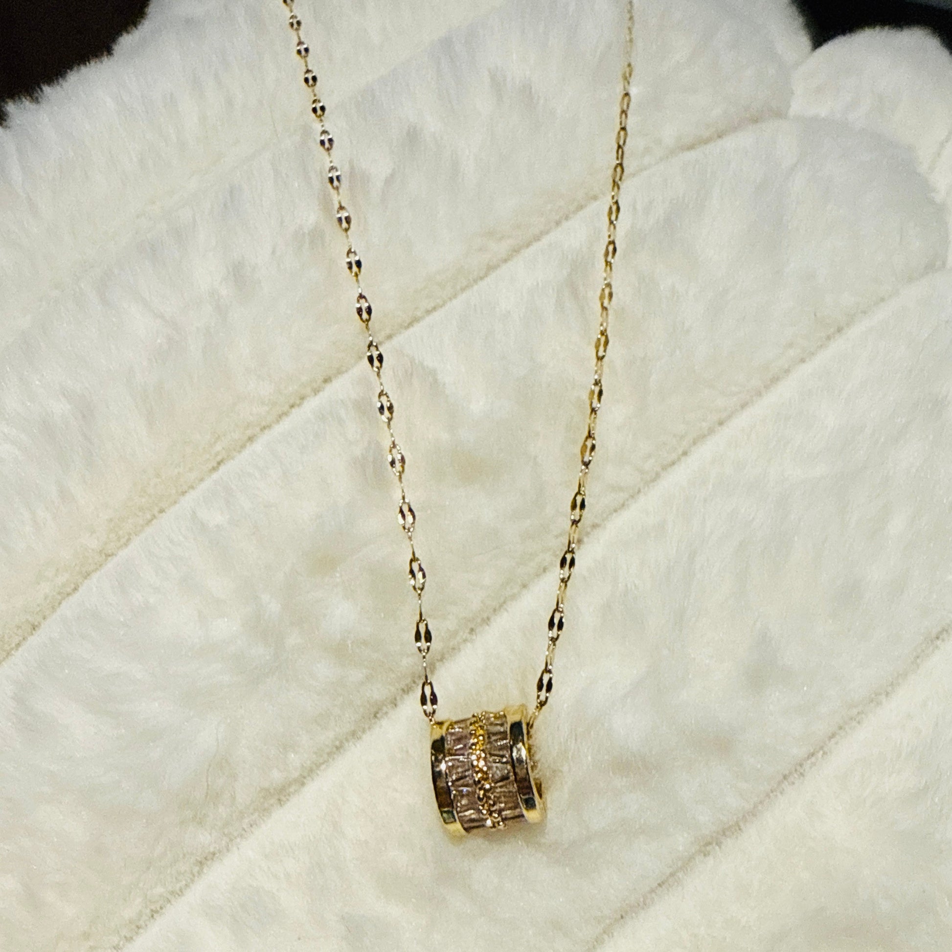 This piece utilizes 18K gold plated over titanium offering a luxurious look at an accessible price, with zirconia providing significant sparkle and clarity.