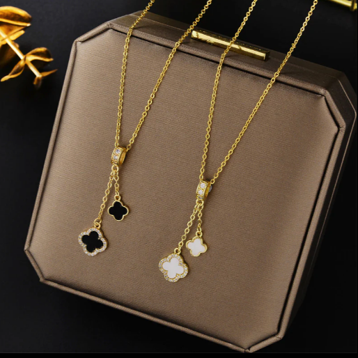 The design offers a sophisticated look, suitable for adding a touch of charm and luck to any outfit.