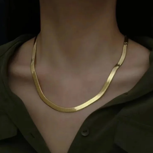 This necklace is a popular accessory, often worn as a standalone statement  piece or layered with other necklaces.