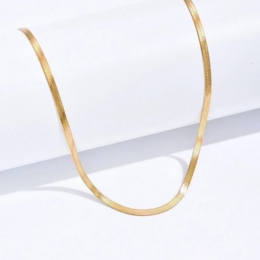 Herringbone chain necklace, characterized by its flat, smooth, and flexible design, The V shaped links are tightly woven together, creating a fluid, reflective surface that resembles the bone structure of a herring fish.