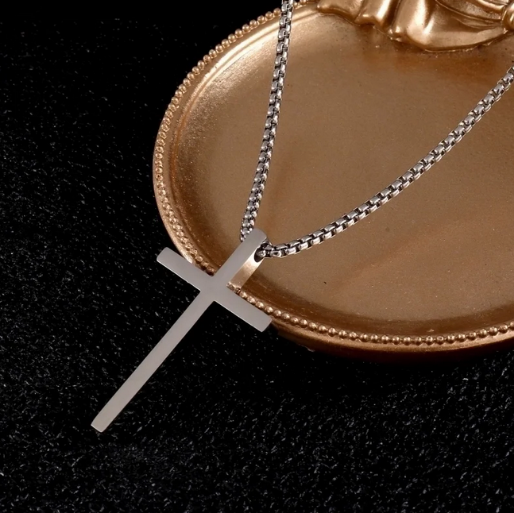 The proportionate size of the cross relative to the chain contributes to its balanced aesthetic.