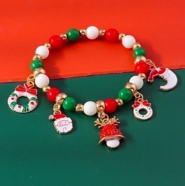 Christmas-themed beaded bracelet with various charms, including Santa Claus face, festive wreaths, a Christmas bell, and a crescent moon with a Santa hat. The bracelet is designed to be worn as a festive accessory, adding a touch of holiday spirit to any outfit.