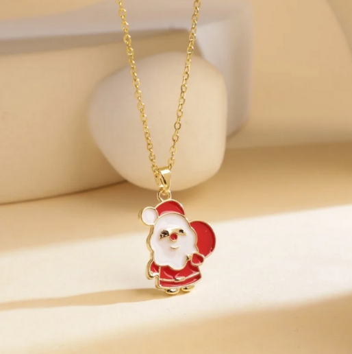 Beautiful necklace that captures the classic Santa Claus image with clear, vibrant red enamel. The gold outline of the pendant adds a polished touch, and matches the dedicate gold chain that holds the pendant.