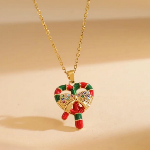 Candy cane enamel pendant on a gold tone dainty chain.