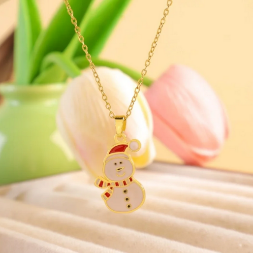 Snowman enamel pendant on a dainty gold tone chain.
