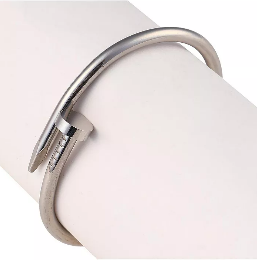 Close-up of a silver bracelet on a white background