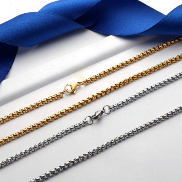 Two gold and  silver  chain necklaces on a white background