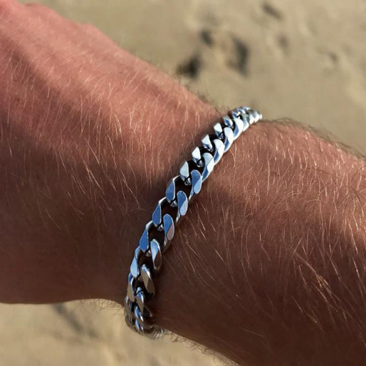 Silver Cuban link bracelet which are a fashion staple associated with urban culture, adding a bold statement-making element to any outfit.