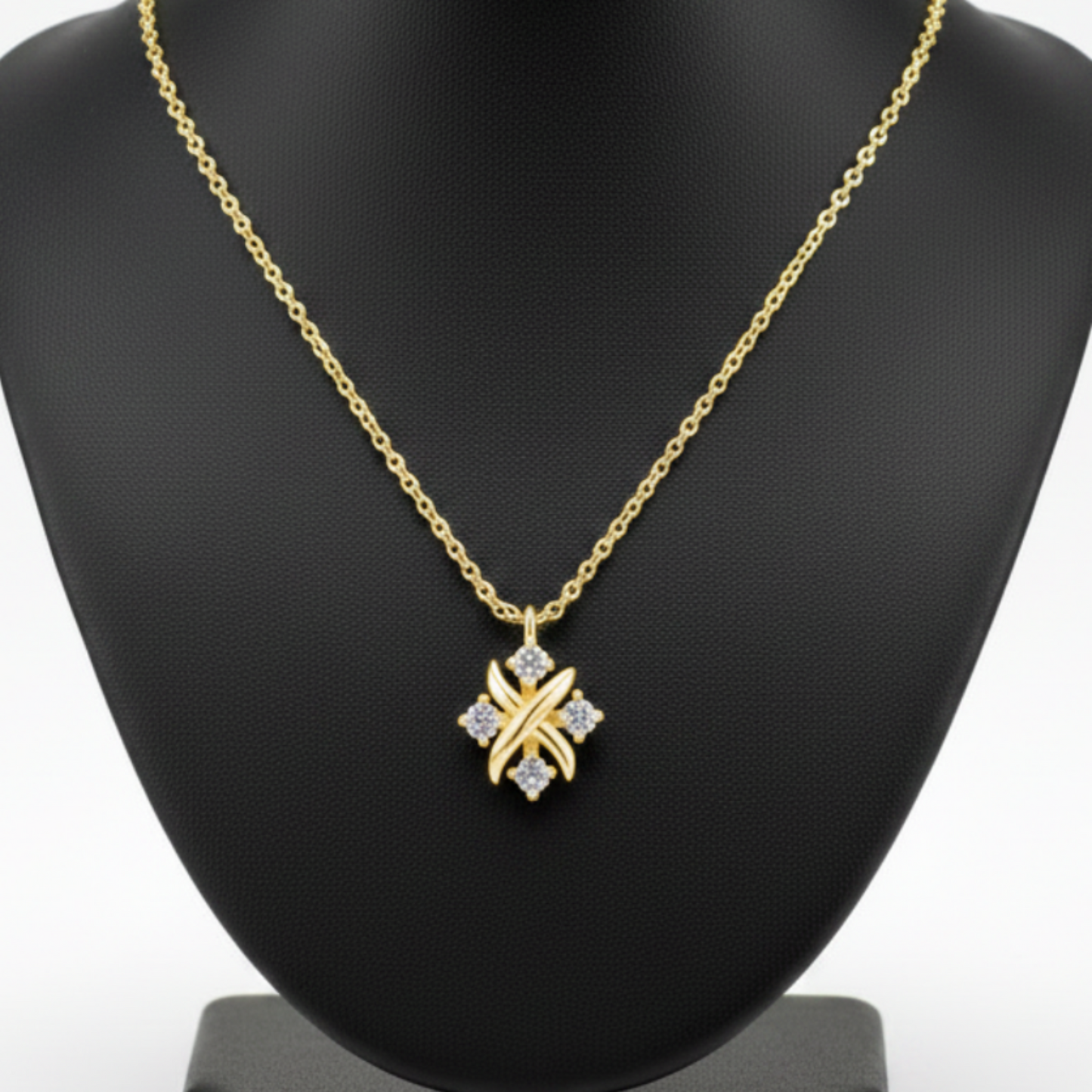 Gold necklace with a star-shaped pendant on a white background