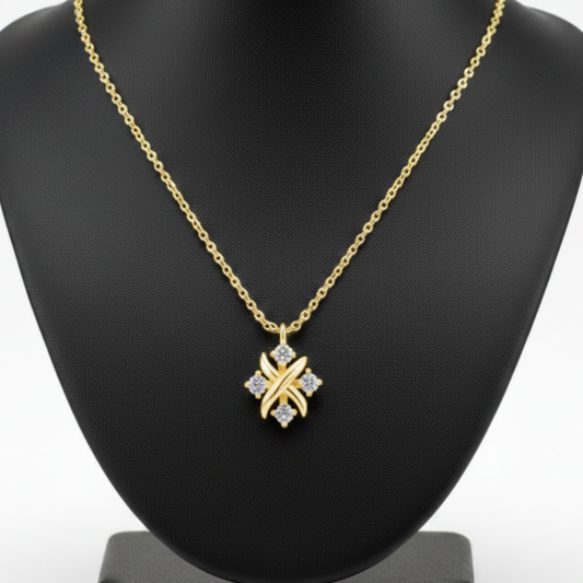 Gold necklace with a star-shaped pendant on a white background