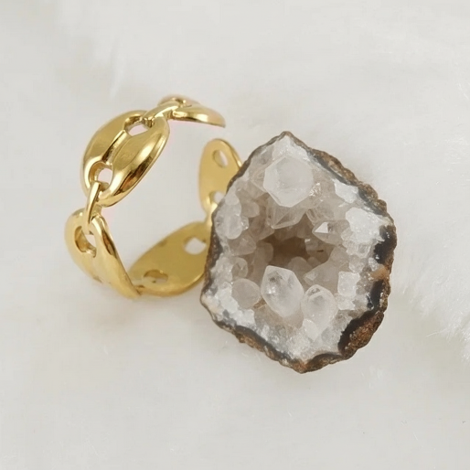 The high shine gold finish catches the light beautifully, highlighting the smooth curves and secure connection of each link. The open-ended style is clearly visible, contributing to its modern appeal.