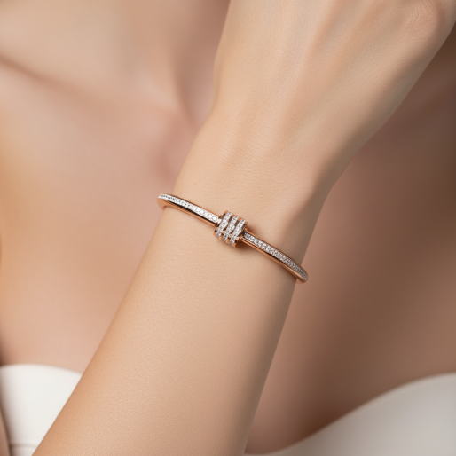 This warm rose gold tone bangle bracelet embellished with zircons along the top, can be worn individually for a subtle sparkle or together for a more pronounced, layered statement.  