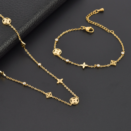 Details of the gold-tone set of bracelet and necklace, showing the synergy between both, that creates a cohesive look that can elevate any outfit.