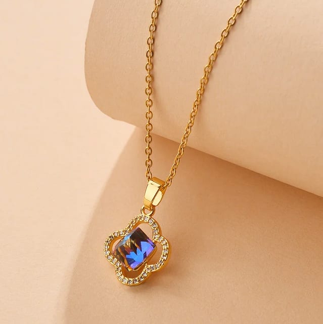 Gold Clover Necklace with an Iridescent Gem