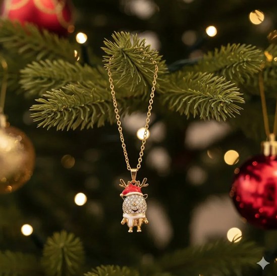 Rhinestone reindeer necklace hanging on a Christmas tree
