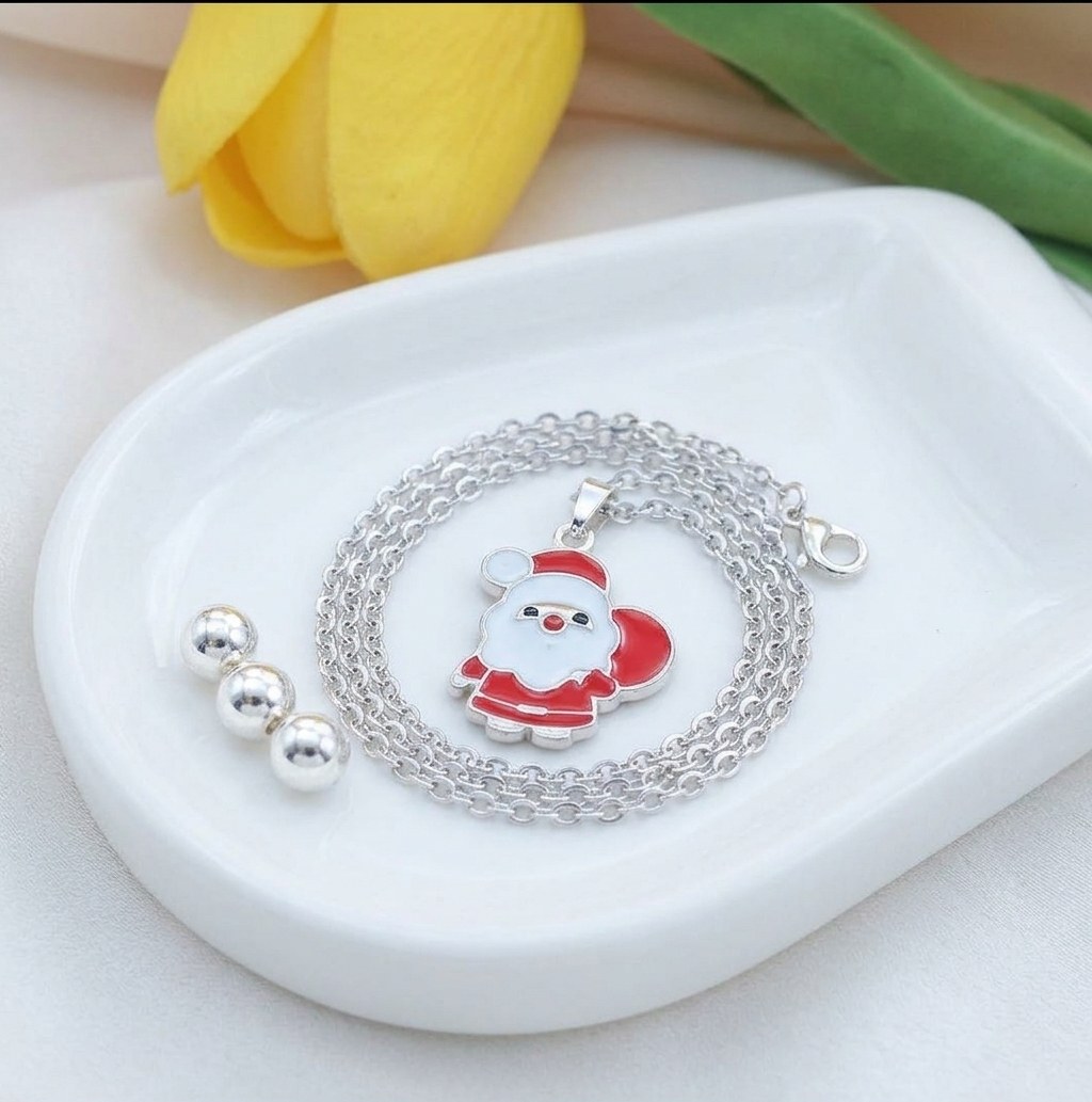 Christmas Santa necklace on a white dish
